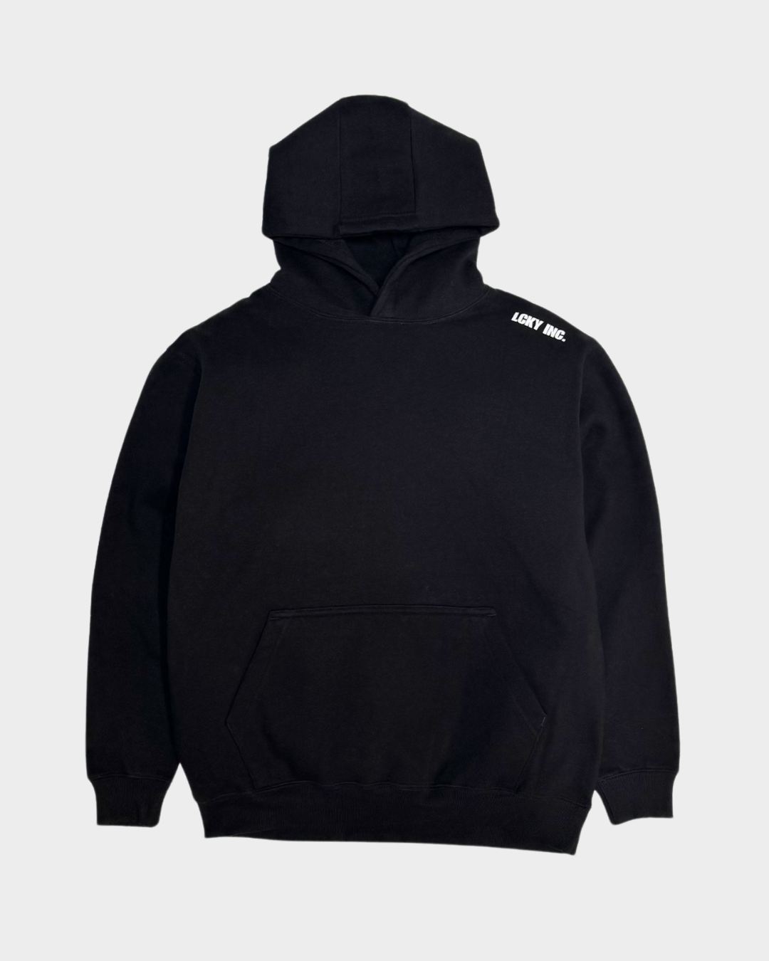 Black hoodie with text on shoulder against a light gray background